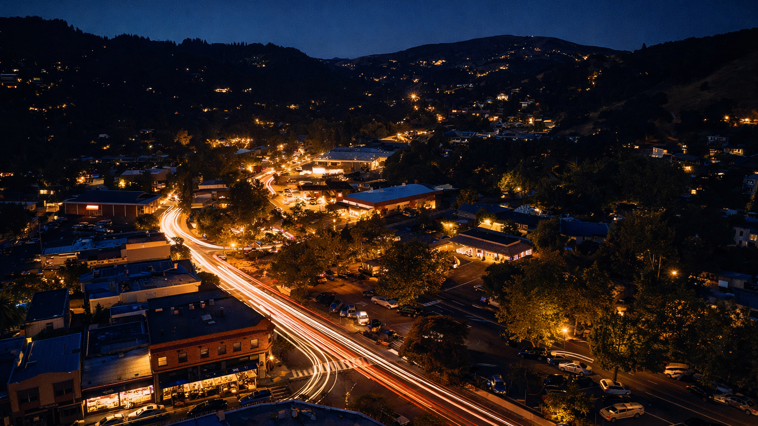 Fairfax at night from above, light trails on Sir Francis Drake and lit hillsides